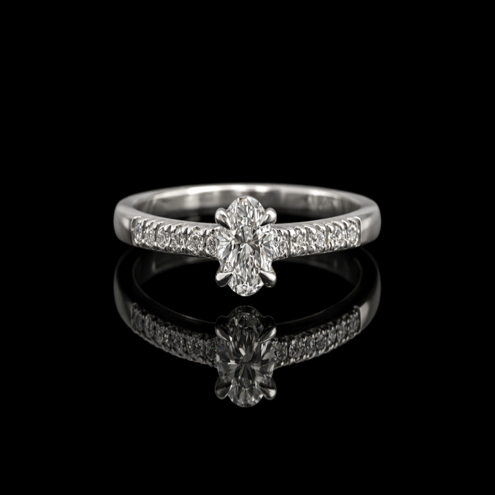 The Elara Oval: Stunning Oval-Cut Solitaire in Polished Silver – Minimalist Engagement Ring with Sparkling Accent Band