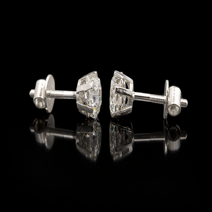 Sparkling Snowflake Silver Stud Earrings – Brilliant Round Solitaire with Decorative Star Setting